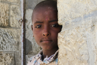 Image of a child in Ethiopia looking into the camera.
