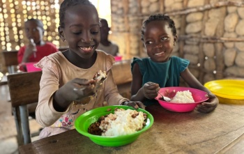 girls eating Mary's Meals in Mozambique