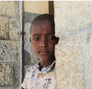 Image of a child in Ethiopia looking into the camera.